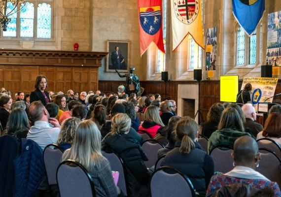 faculty and staff gathered in Great Hall